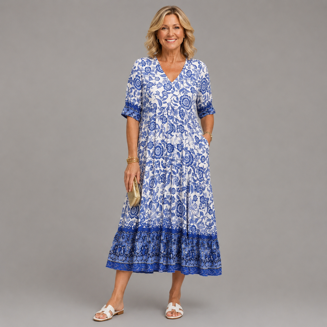 Blue floral V-neck tiered midi dress with short sleeves and ruffled hem