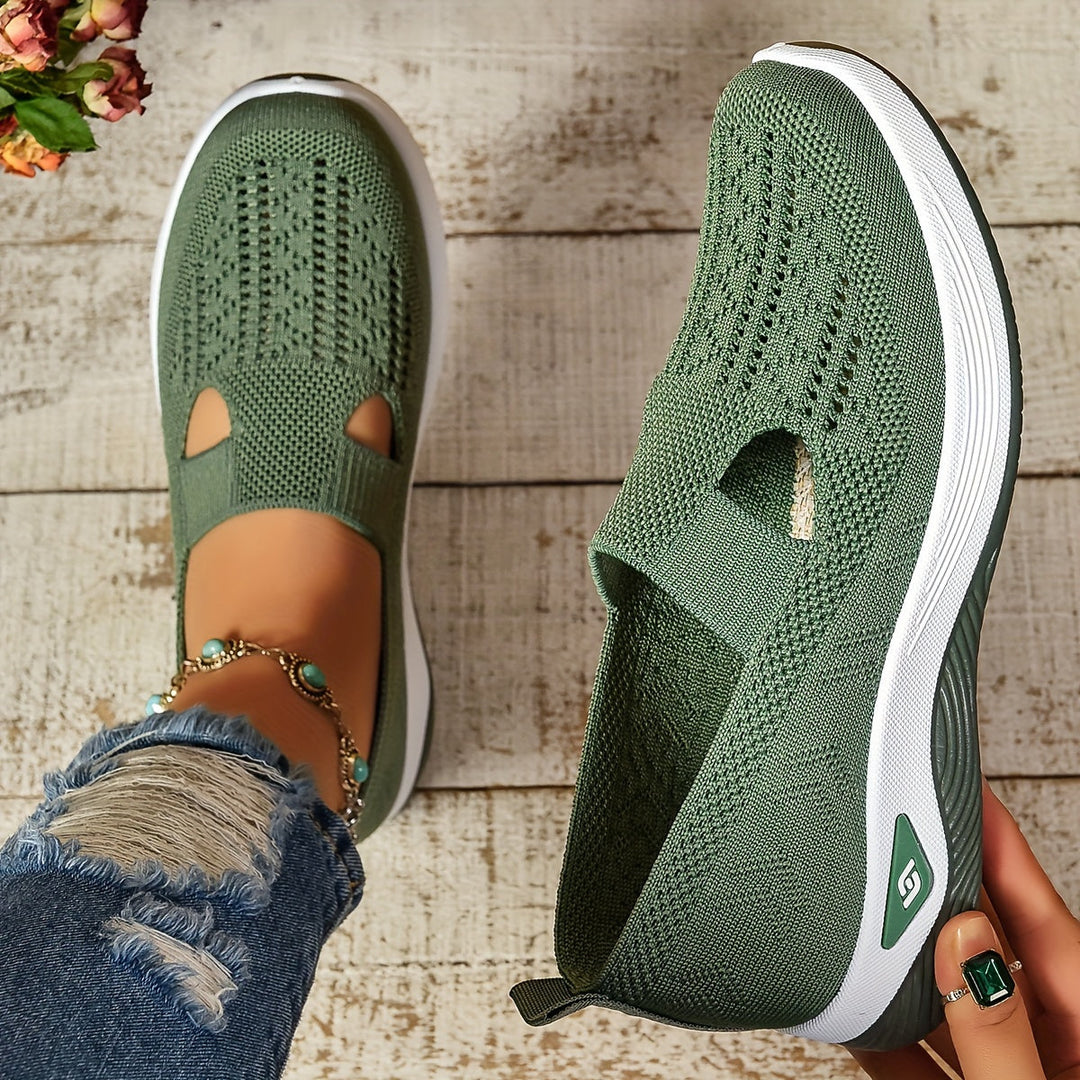 Green knit slip-on sneakers, side view, with white sole and toe cutouts