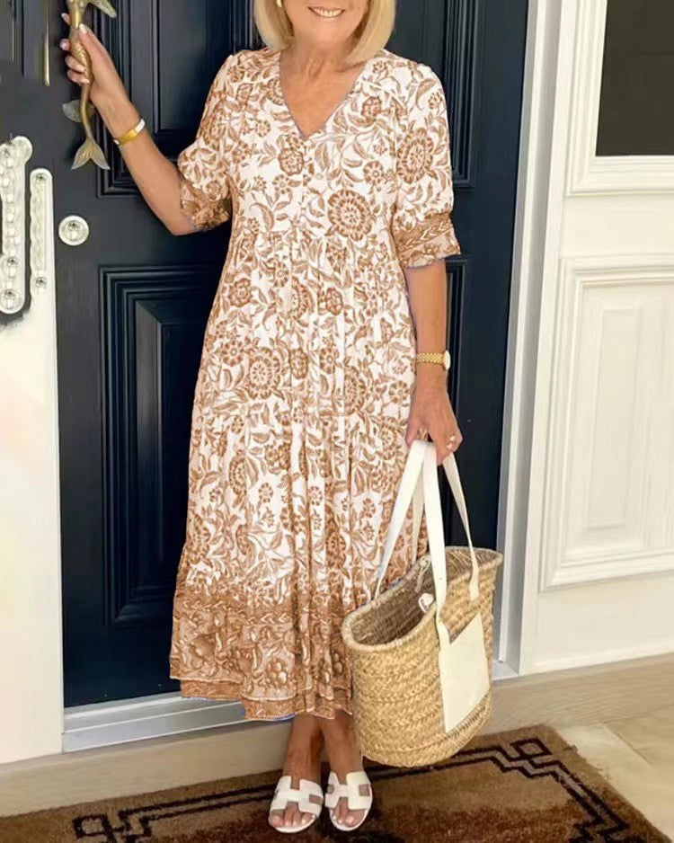 Tan floral V-neck tiered midi dress with short sleeves and ruffled layered hem