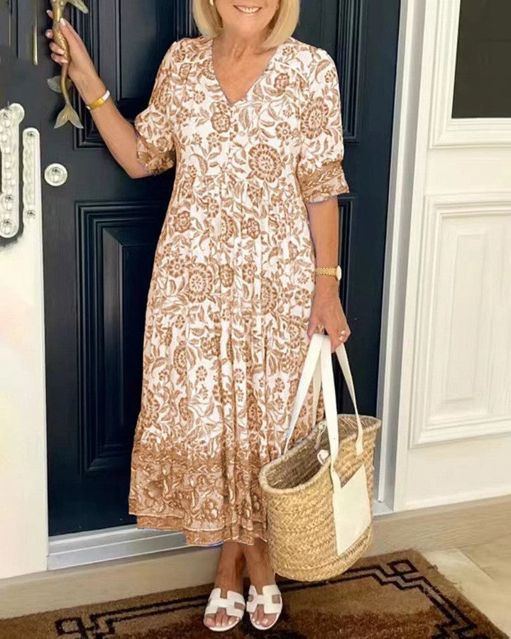 Tan floral V-neck tiered midi dress with short sleeves and ruffled layered hem