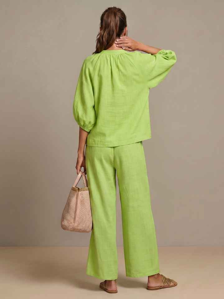 Green blouse and wide-leg pants set, back view, elastic cuffs, drawstring waist