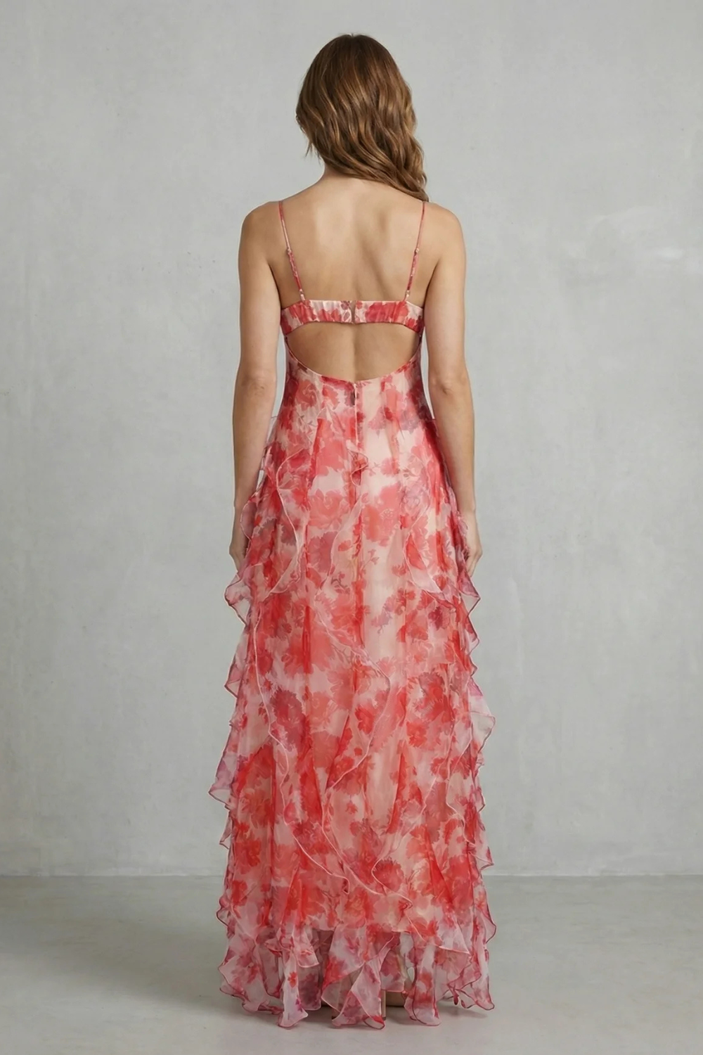 Back view of rose red floral chiffon maxi dress with ruffled tiers and thin straps