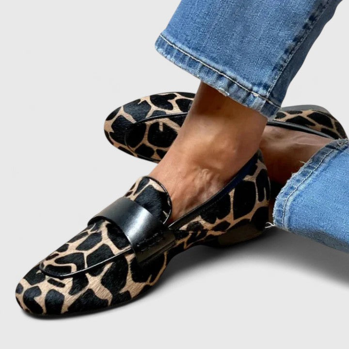 Leopard-print loafer with front strap and buckle, pointed toe, low heel