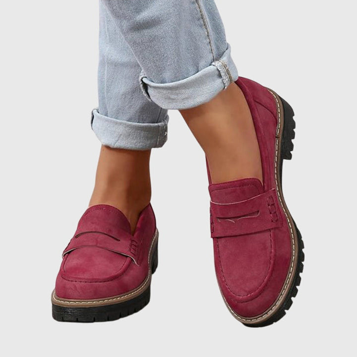 Burgundy chunky slip-on loafers with strap detail and dark tread sole