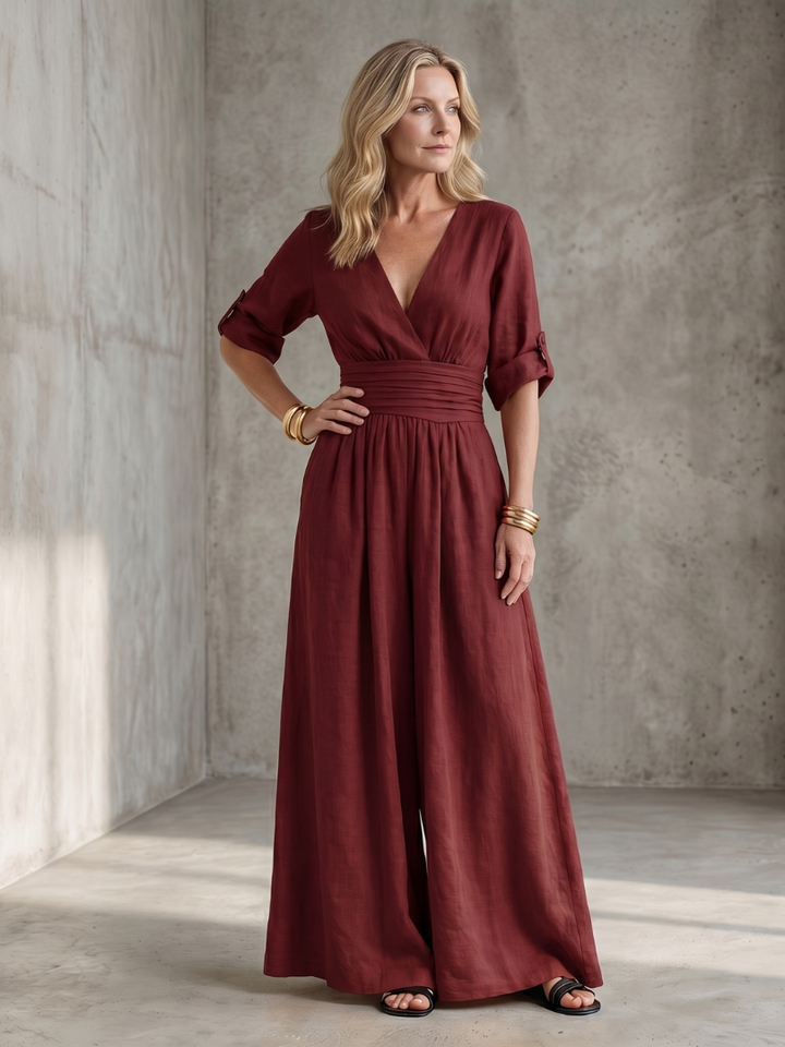 Burgundy wide-leg wrap jumpsuit with V-neck and cinched waist