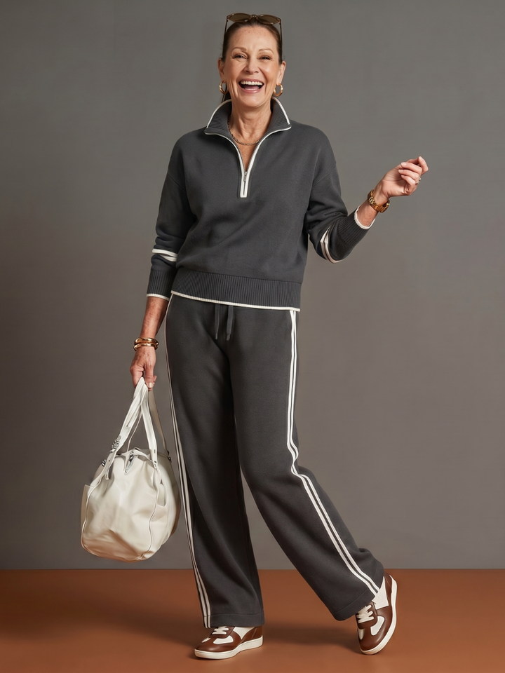 Dark quarter-zip sweatshirt and jogger pants set with white side stripes