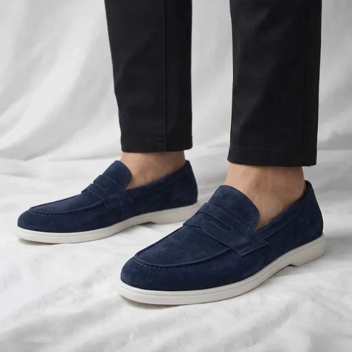 Men's suede loafers in navy blue, slip-on style with white rubber sole
