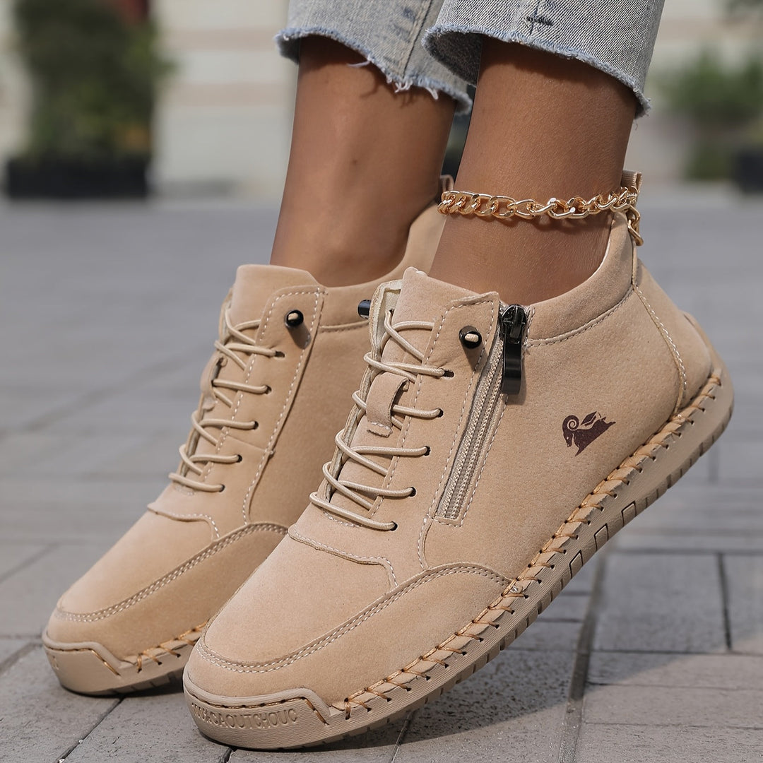 Khaki side-zip lace-up sneakers with chain detail, textured sole, and lace-up front