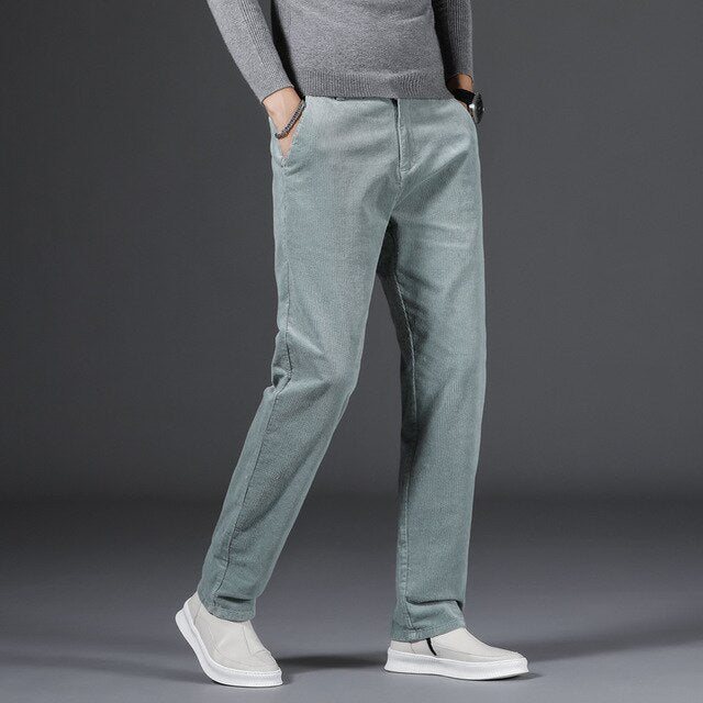 Medium-waist corduroy pants in light blue with front pockets and cuffed hems