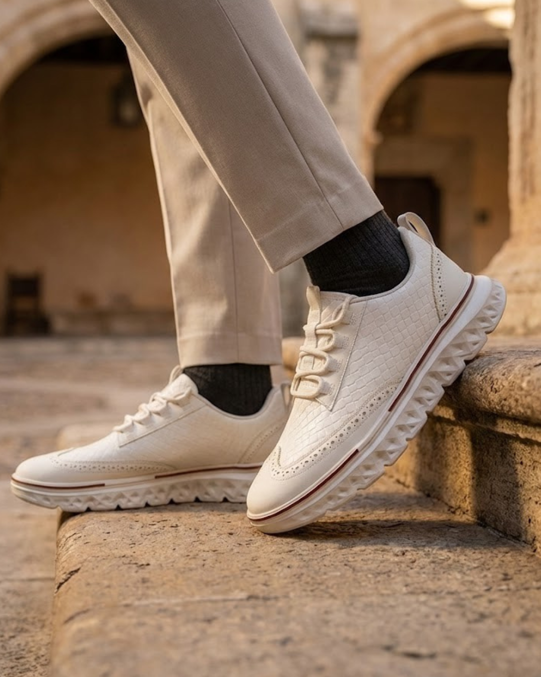 White lace-up dress sneaker with low profile and textured tread sole