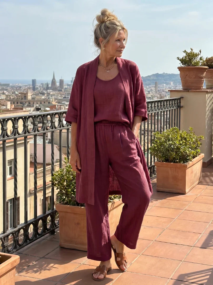 Women’s lounge set in wine red: draped open cardigan with camisole and relaxed wide-leg pants.