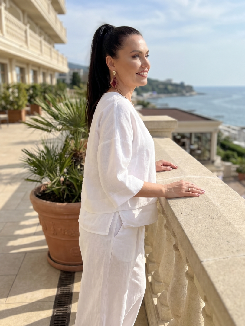 White two-piece wide-leg pants set with V-neck top and flowy wide pants