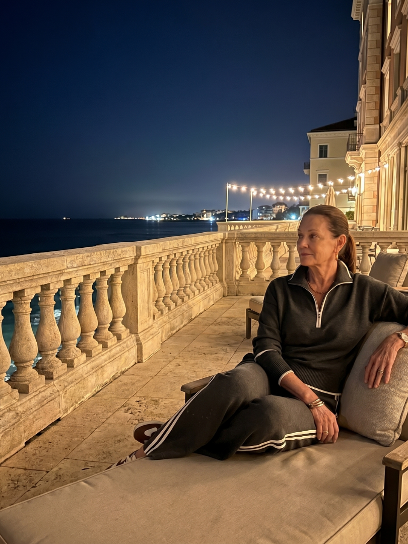 Dark two-piece loungewear set with quarter-zip top and striped sweatpants
