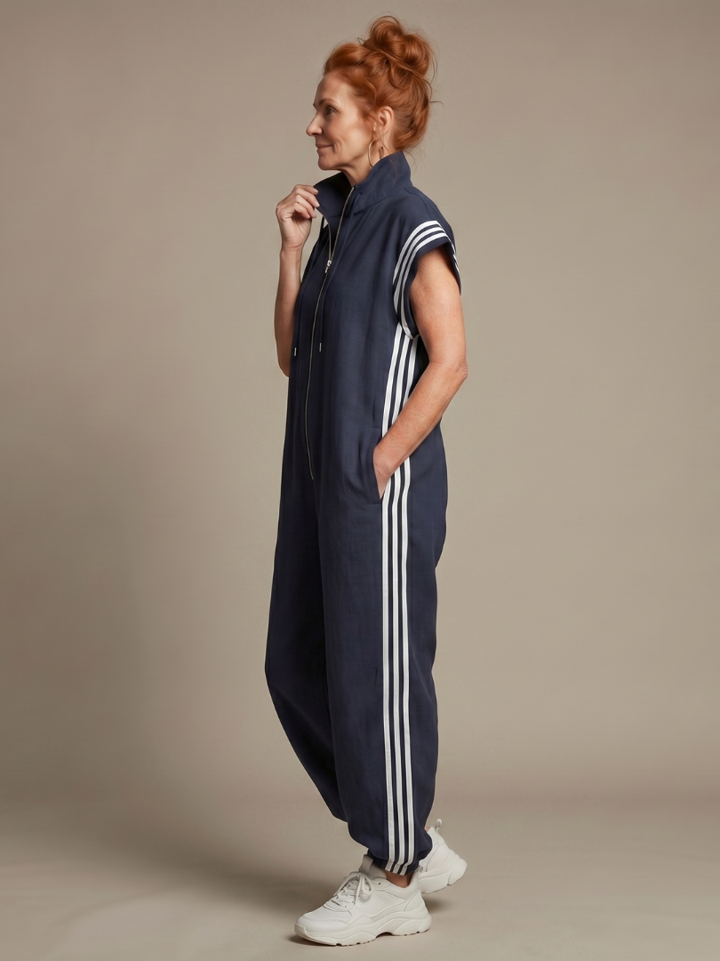 Blue sleeveless zip-front jumpsuit with striped shoulder panels and side stripe legs
