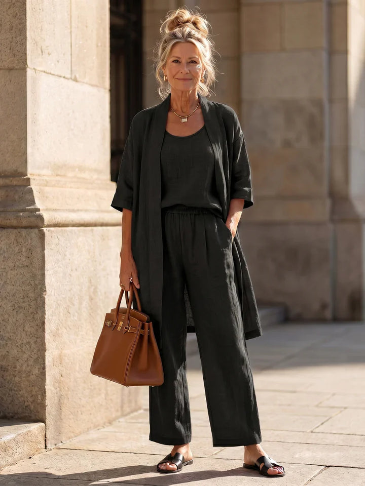 Black lounge set with robe over tank and wide-leg pants