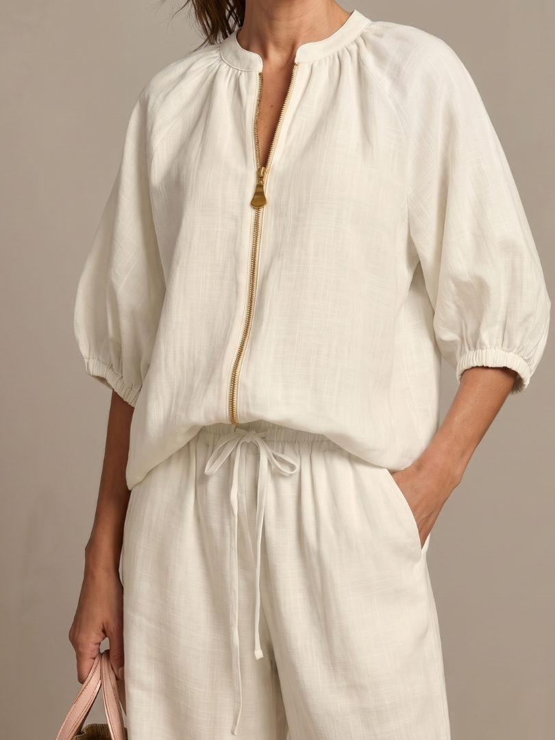 Women’s white pants set top, puff sleeves, front zip with tassel detail, drawstring waist