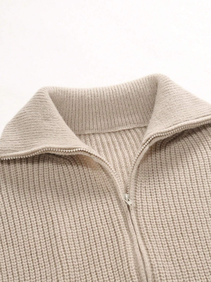 Beige ribbed collar zip-up cardigan with visible zipper seam