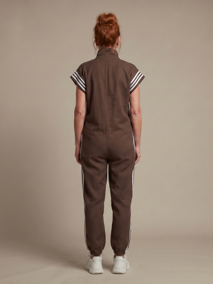Back view brown sleeveless zip-front jumpsuit with white striped shoulder trim