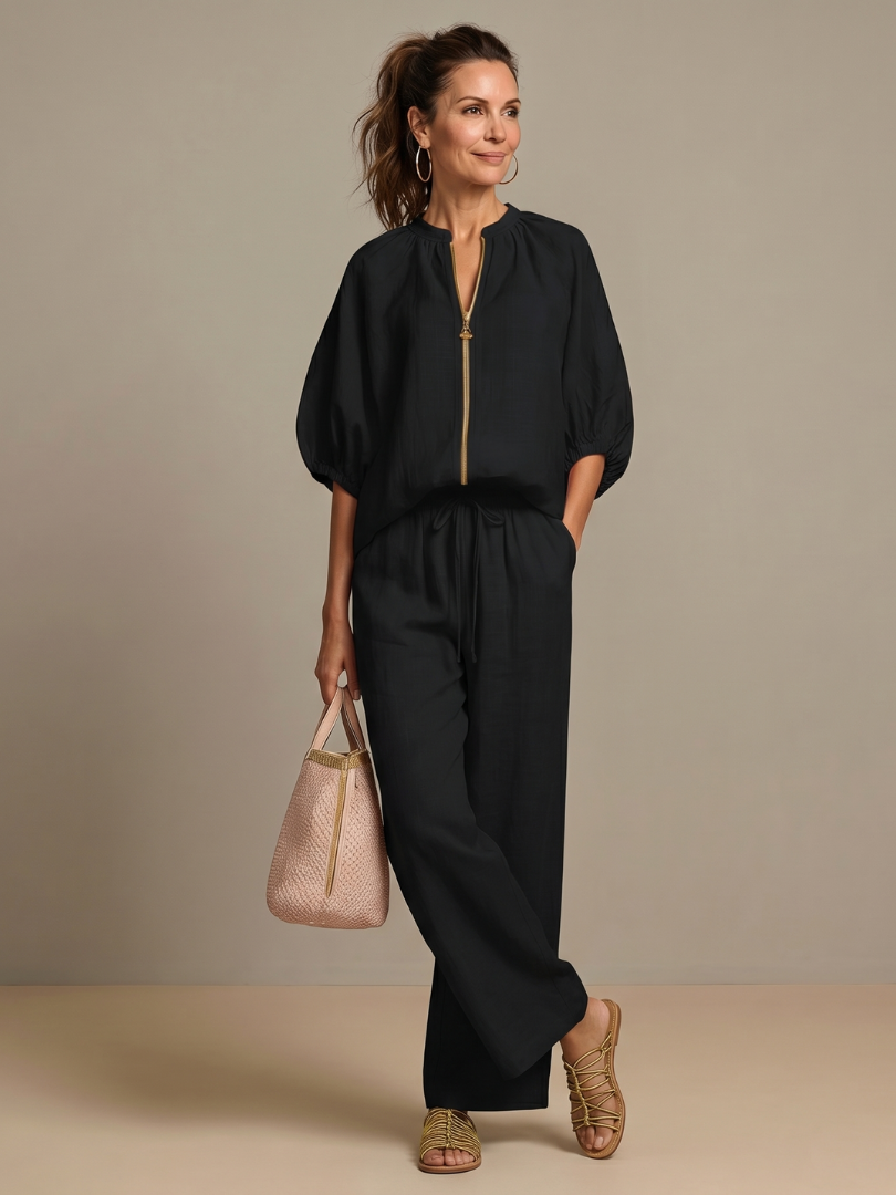 Women’s 2-piece pants set in black, puff sleeve blouse with front zip, wide-leg trousers