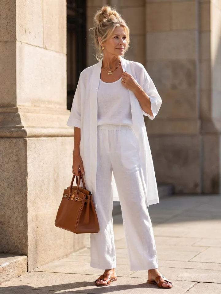 White women’s lounge set with short-sleeve top, drawstring pants, and open kimono-style robe