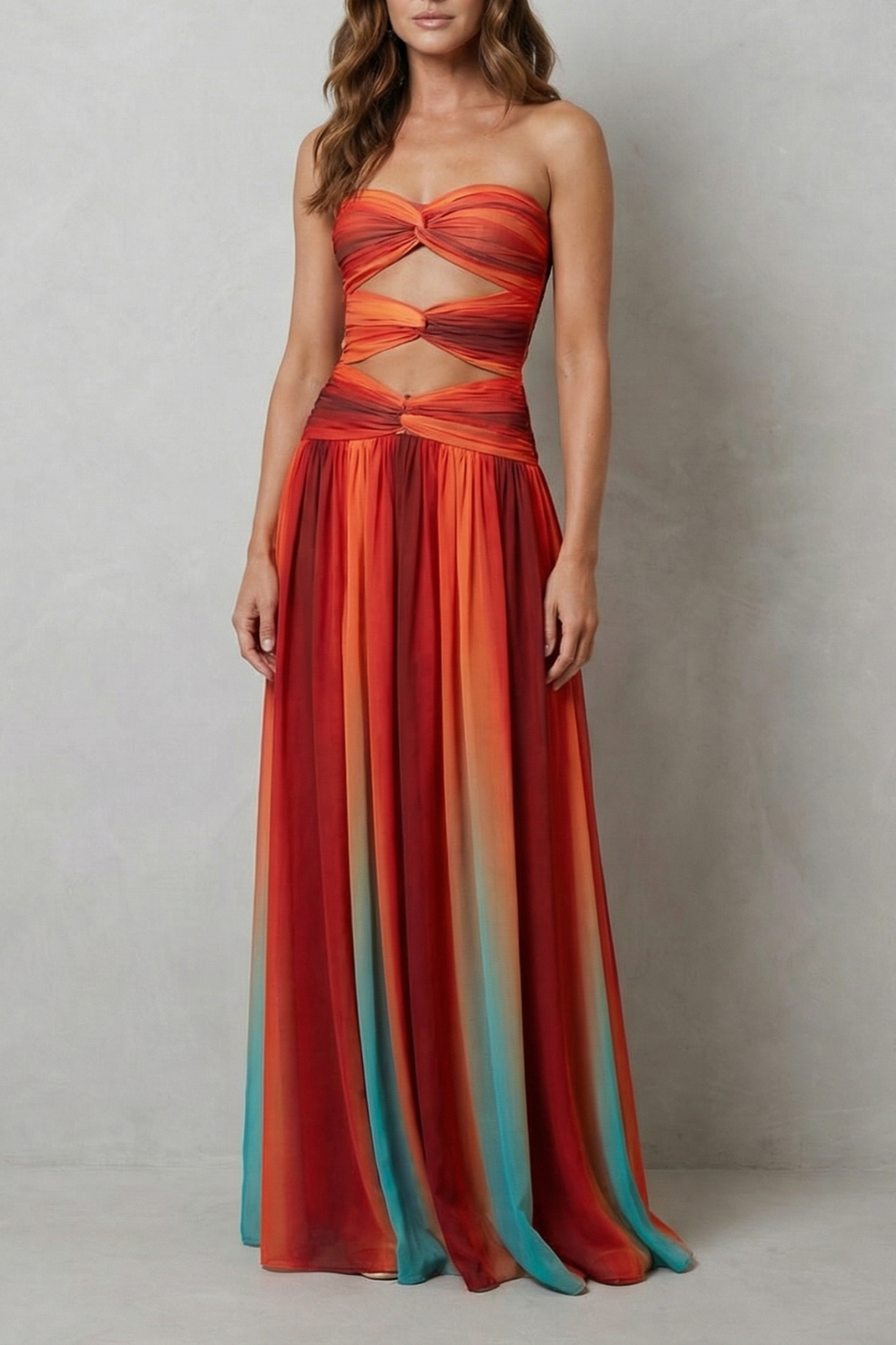 Strapless ombre maxi dress in red and teal with gathered bust bow.