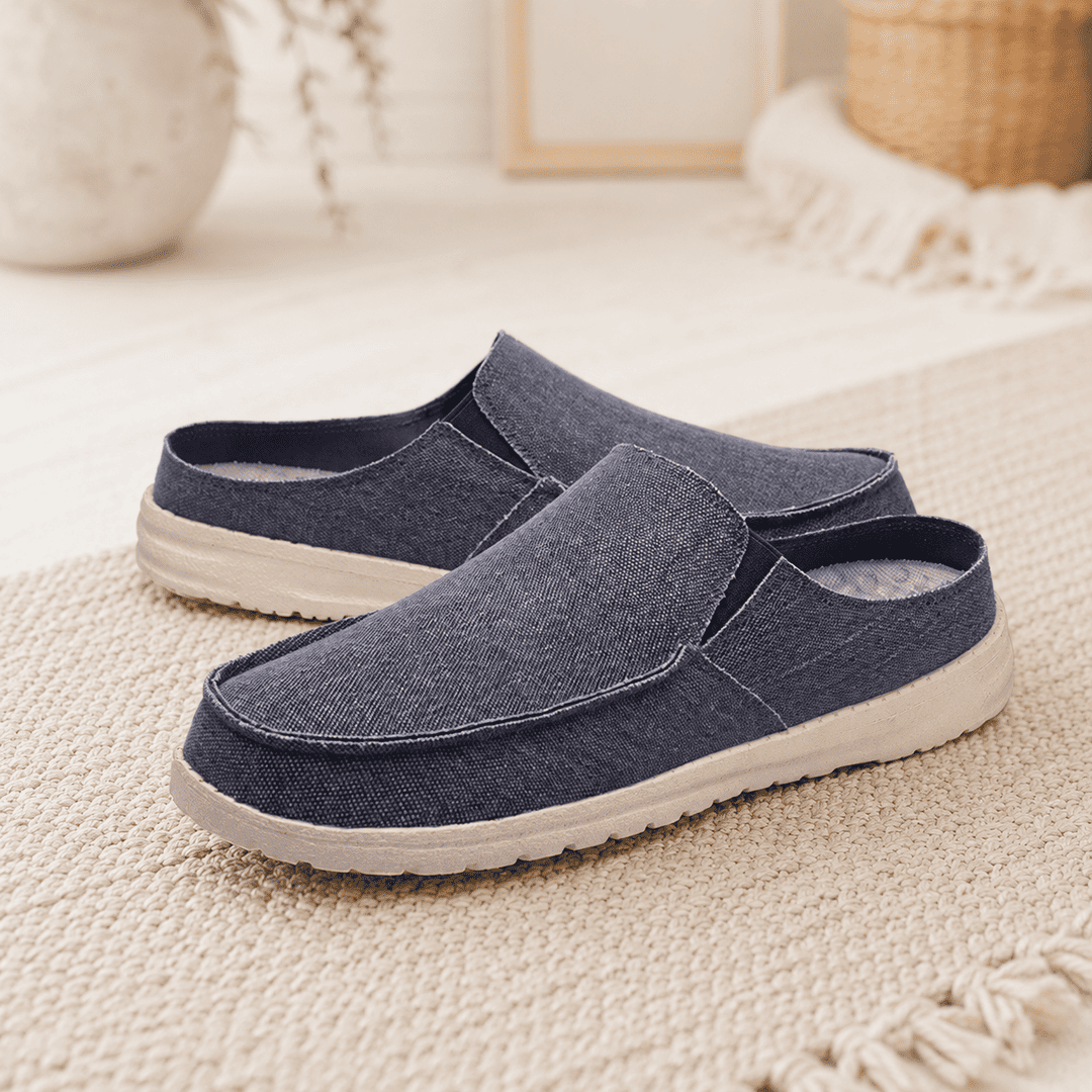 Slip-on shoes in dark blue textured fabric with cushioned white rubber sole