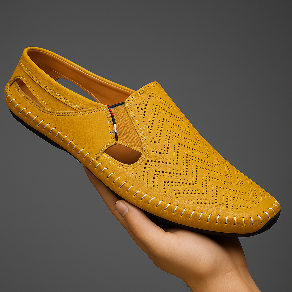 Yellow perforated slip-on sandals with moc toe and contrast stitched rubber sole