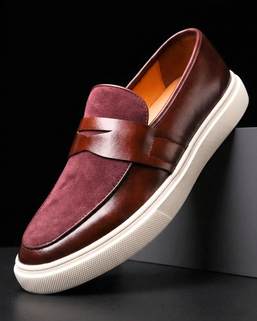 Burgundy leather loafer slip-on with strap detail and white textured sole