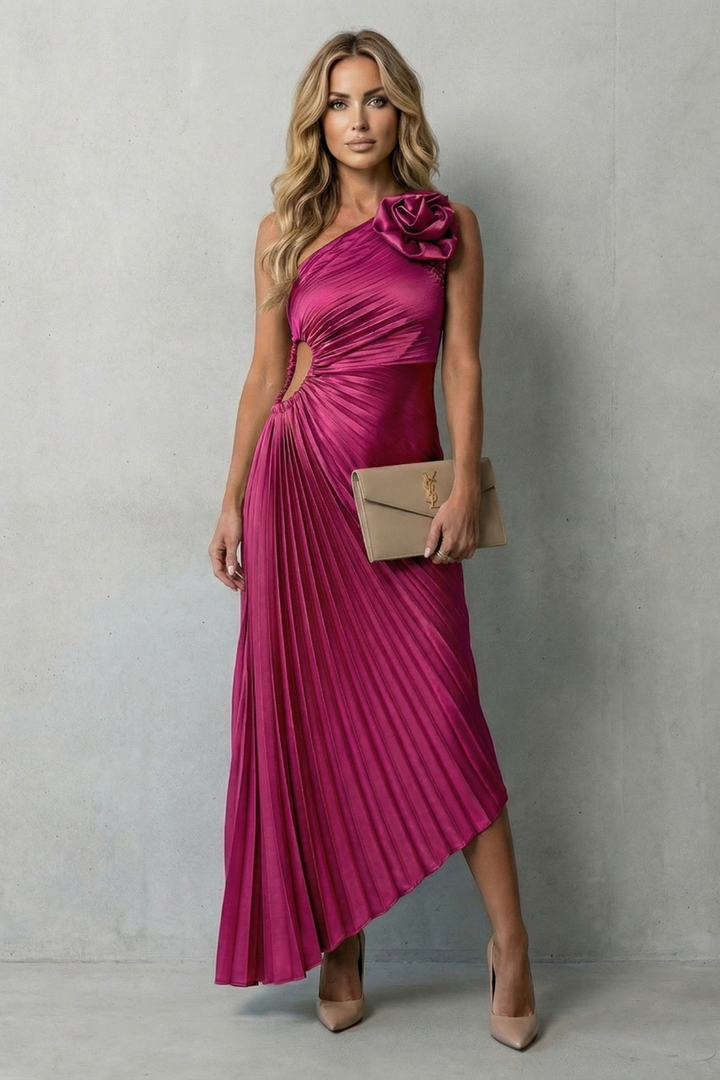 Hot pink pleated sleeveless maxi dress with ruched side bodice and bow shoulder detail.