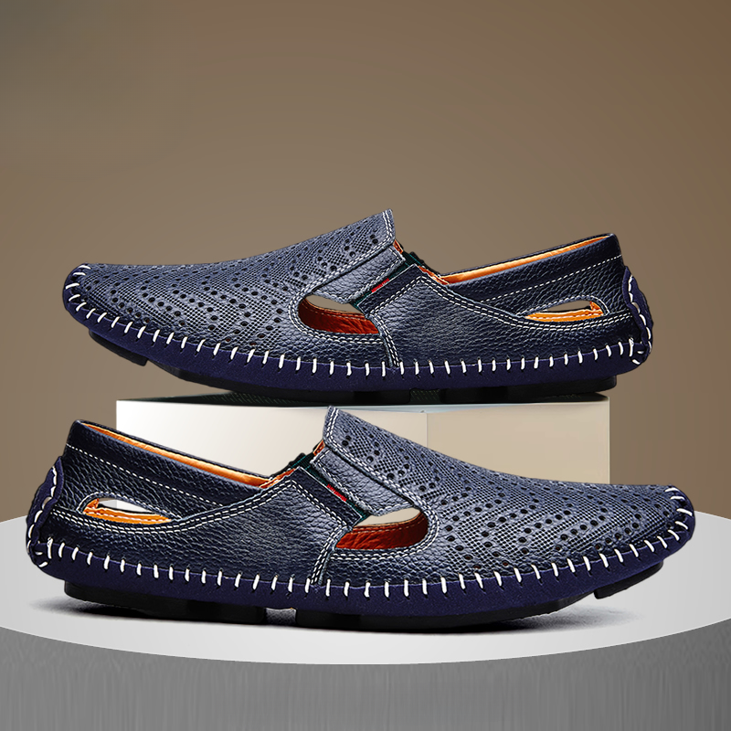 Navy slip-on sandals, perforated upper and moc-style cutout, contrast stitching