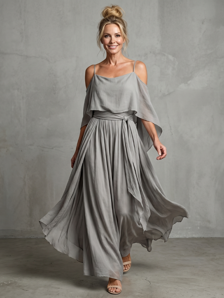 Gray cold-shoulder maxi dress with draped sleeves, pleated skirt, tie waist