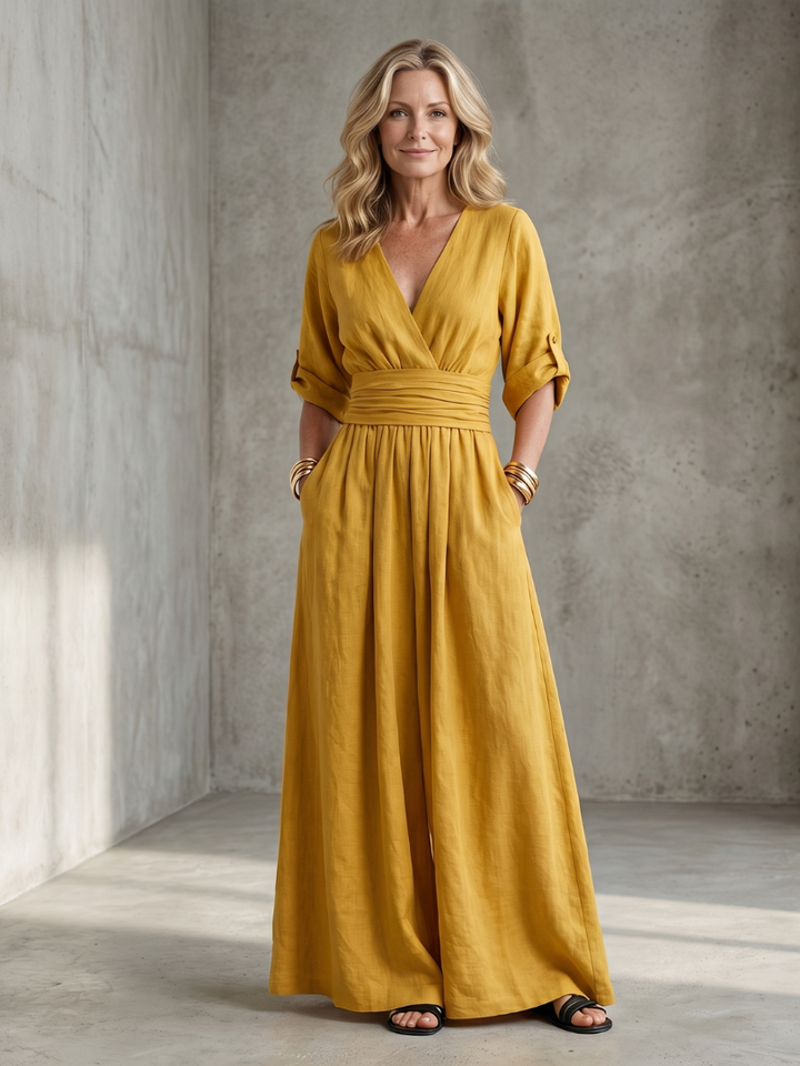 Yellow wide-leg wrap jumpsuit, V-neck with tie waist and gathered skirt