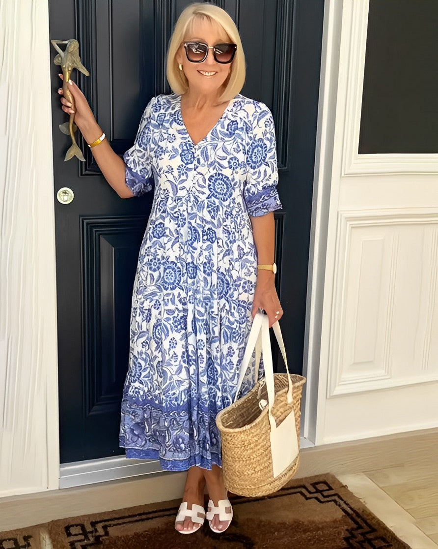 Blue floral V-neck tiered midi dress with short sleeves and layered ruffle hem