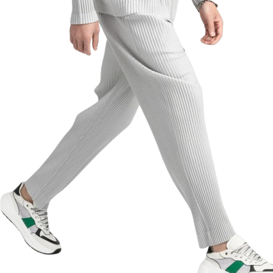 Light gray corduroy cotton pants, vertical ribbing, straight fit, worn with sneakers
