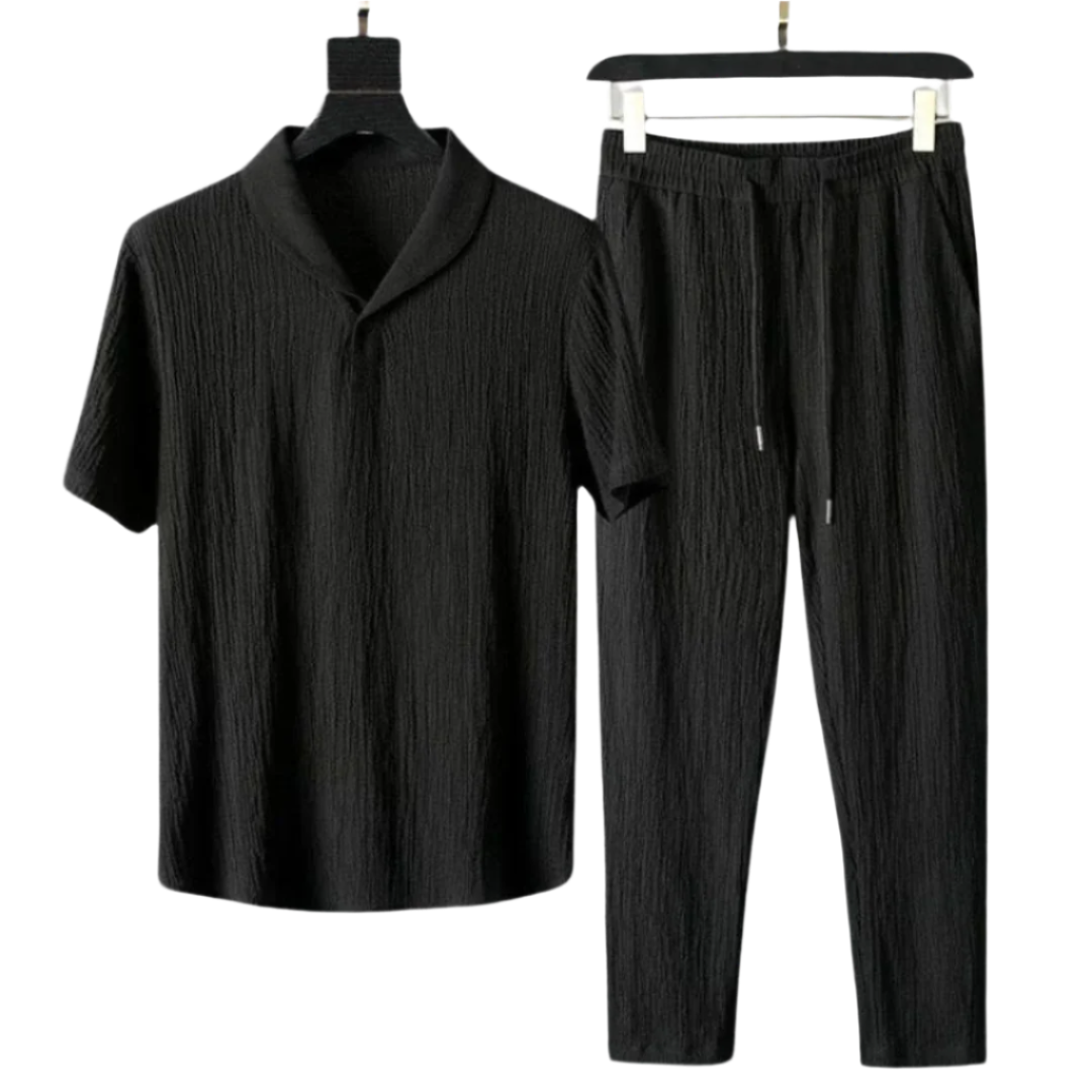 Black cotton polo shirt with short sleeves and black pants set with elastic waist.