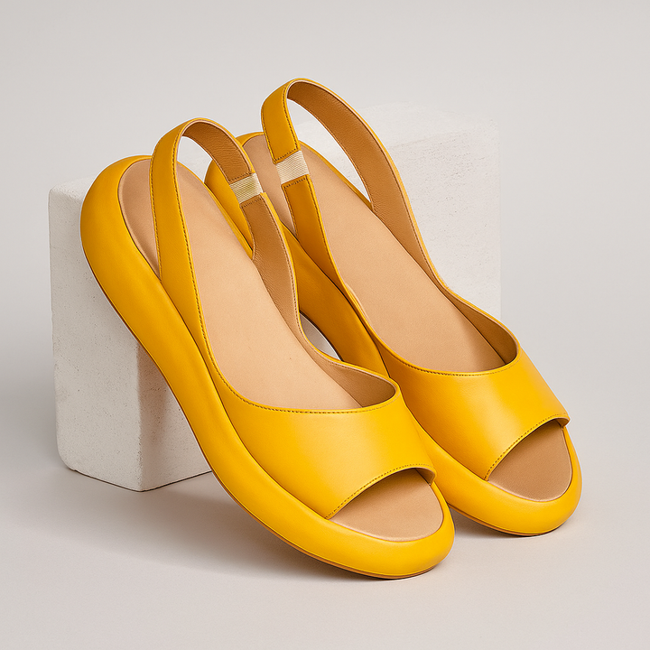 Orthopedic open-toe sandals, yellow pair with open toe and wide side straps.
