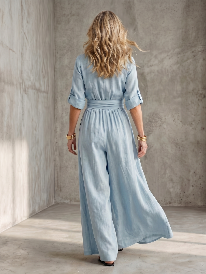 Sky blue wide-leg wrap jumpsuit, back view with gathered waist