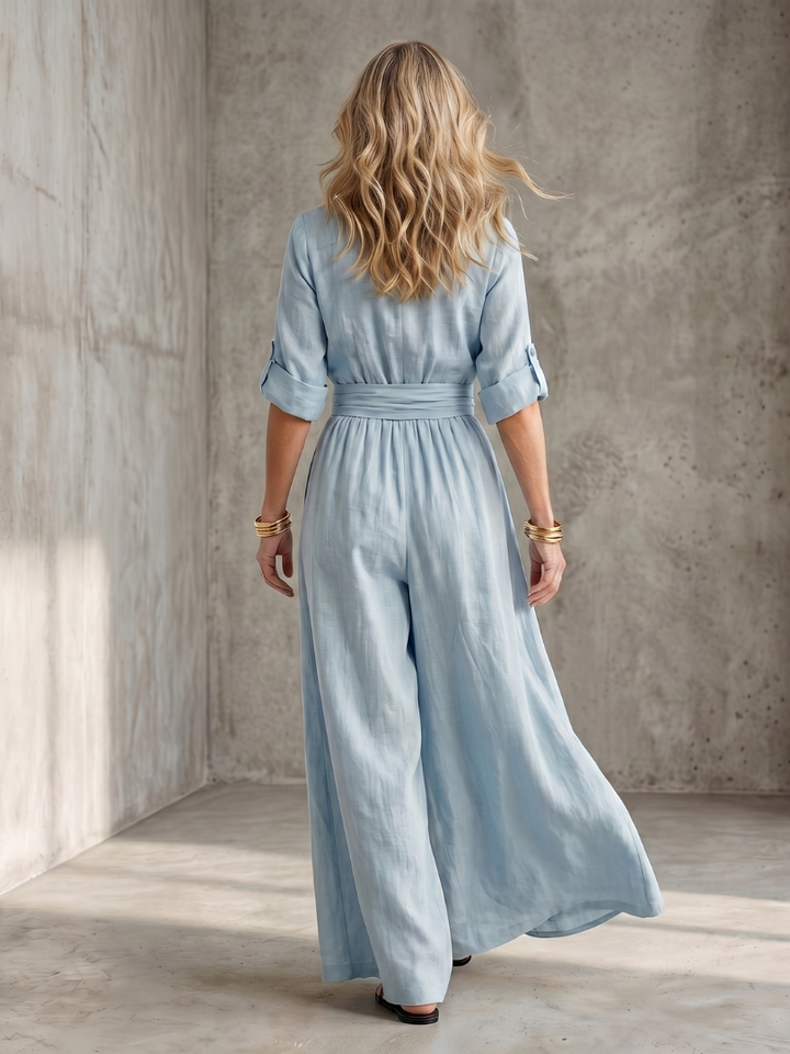 Sky blue wide-leg wrap jumpsuit, back view with gathered waist