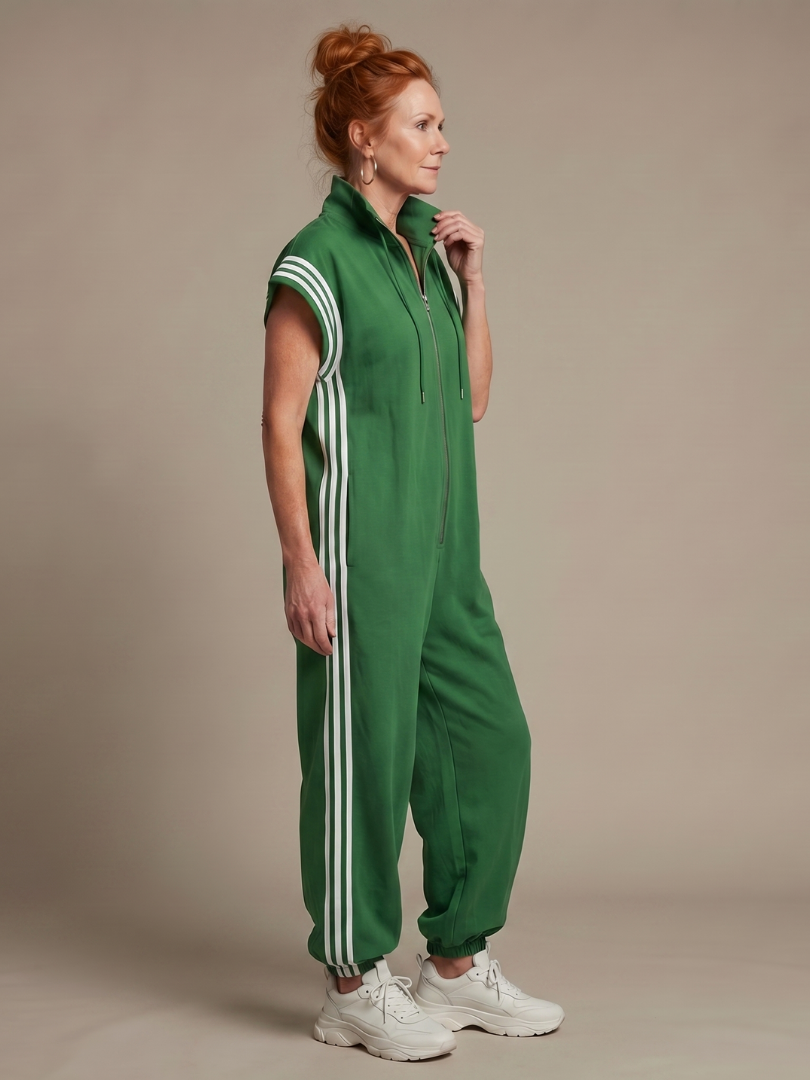 Green sleeveless zip-front jumpsuit with white side stripe detail, loose fit.