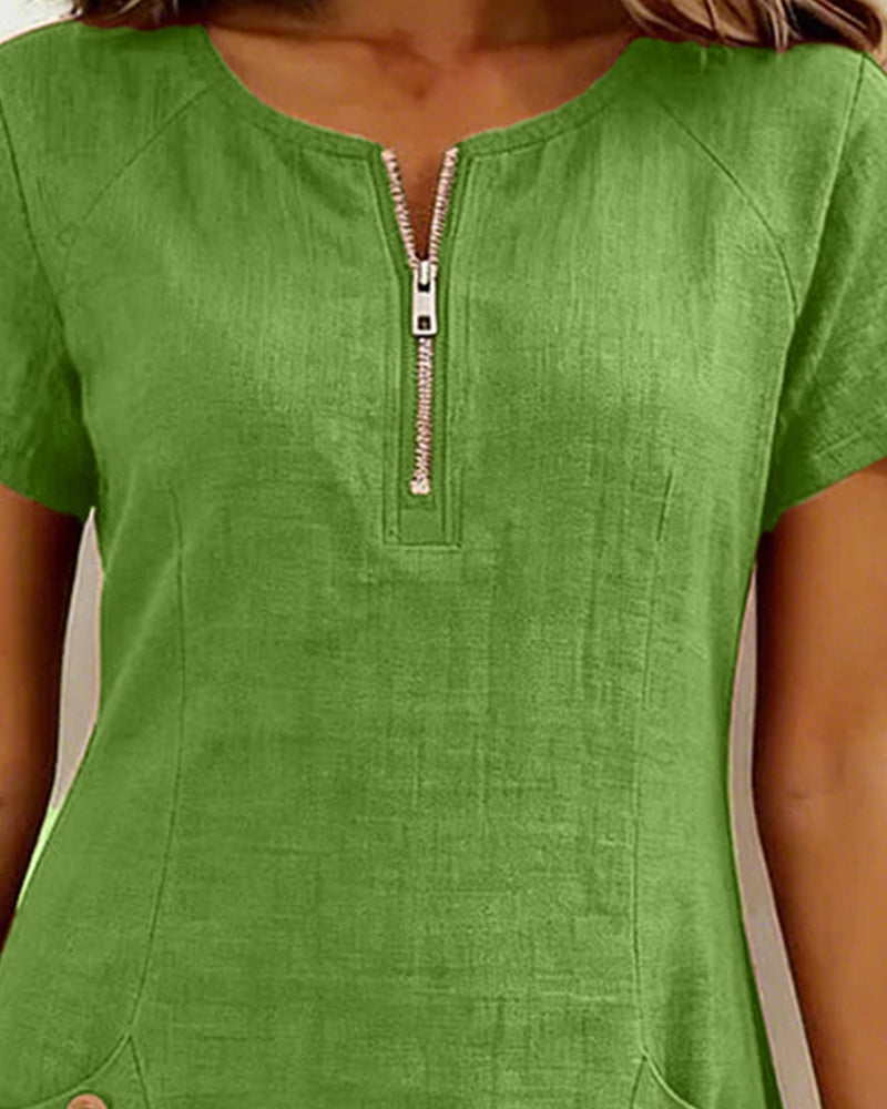 Green casual zip-pocket dress with short sleeves and front half-zip detail