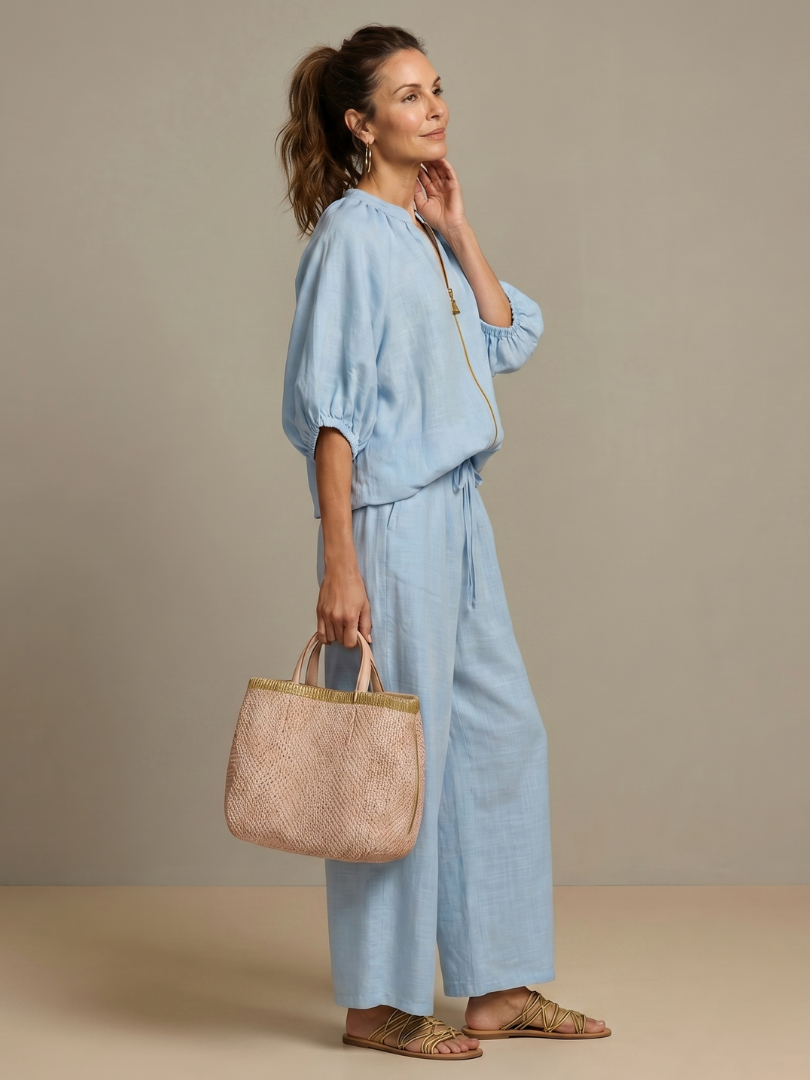 Light blue blouse and wide-leg pants set with zip front, puff sleeves, drawstring waist