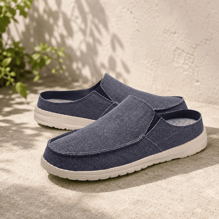 Slip-on shoes in dark navy textured fabric with cushioned white rubber sole
