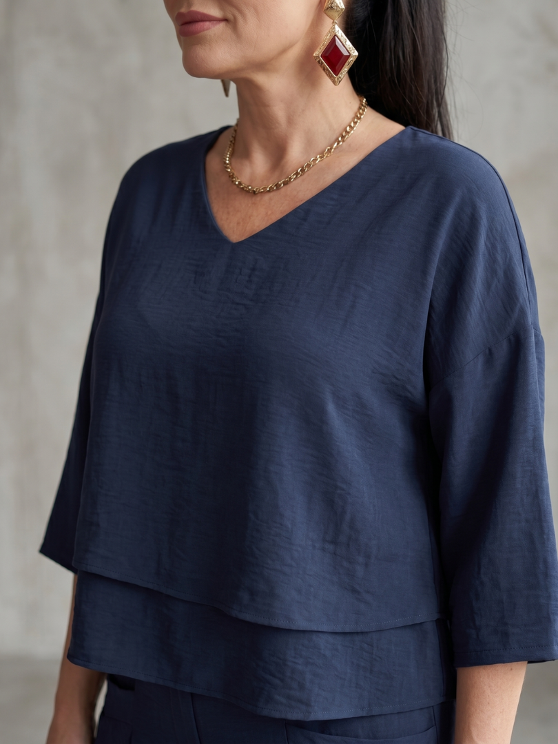Navy wide-leg pants set top with V-neck and elbow-length sleeves, tiered hem.
