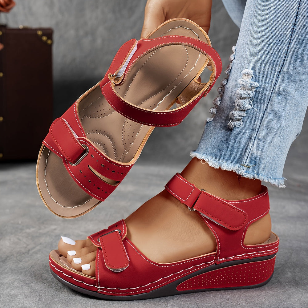Red comfort sandals with two hook-and-loop straps and cushioned wedge sole