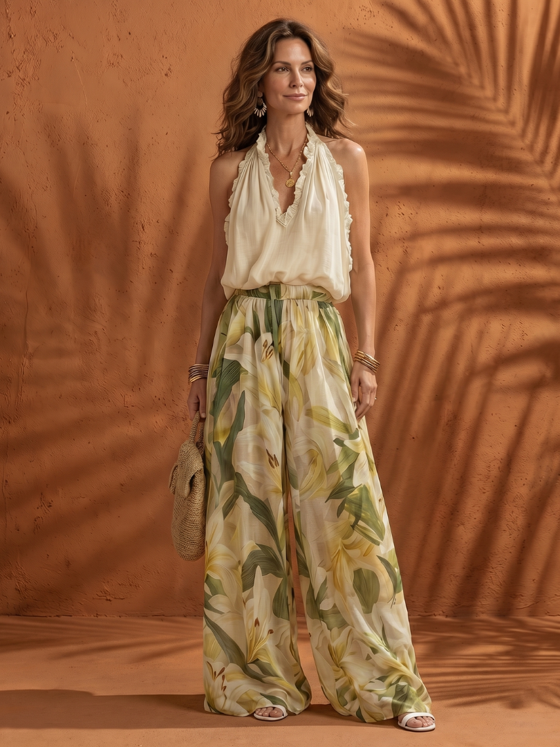 Cream halter top with ruffled neckline and matching floral wide-leg pants