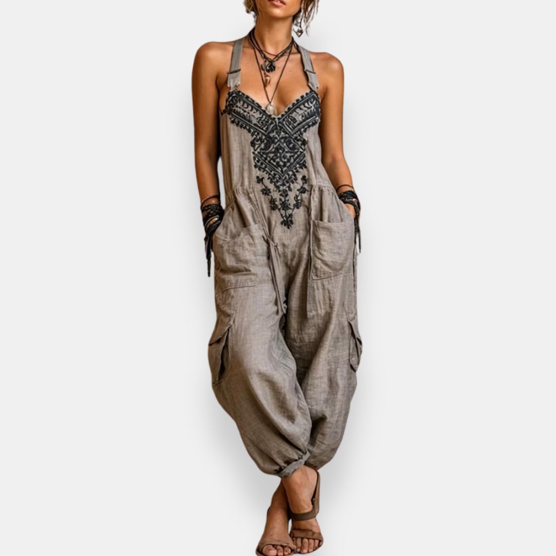 Grey bohemian jumpsuit with embroidered front panel and wide pocketed legs