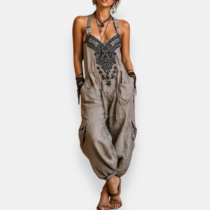 Grey bohemian jumpsuit with embroidered front panel and wide pocketed legs