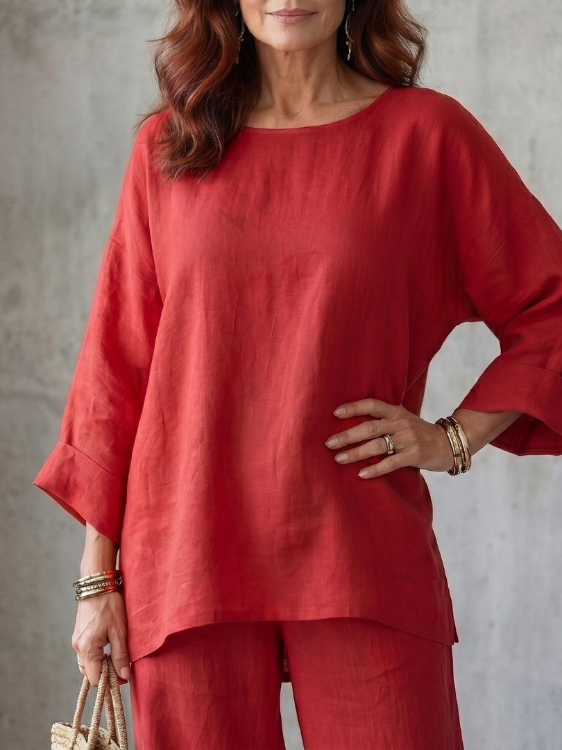 Red loose blouse and matching wide-leg pants set, relaxed neckline and cuffed sleeves