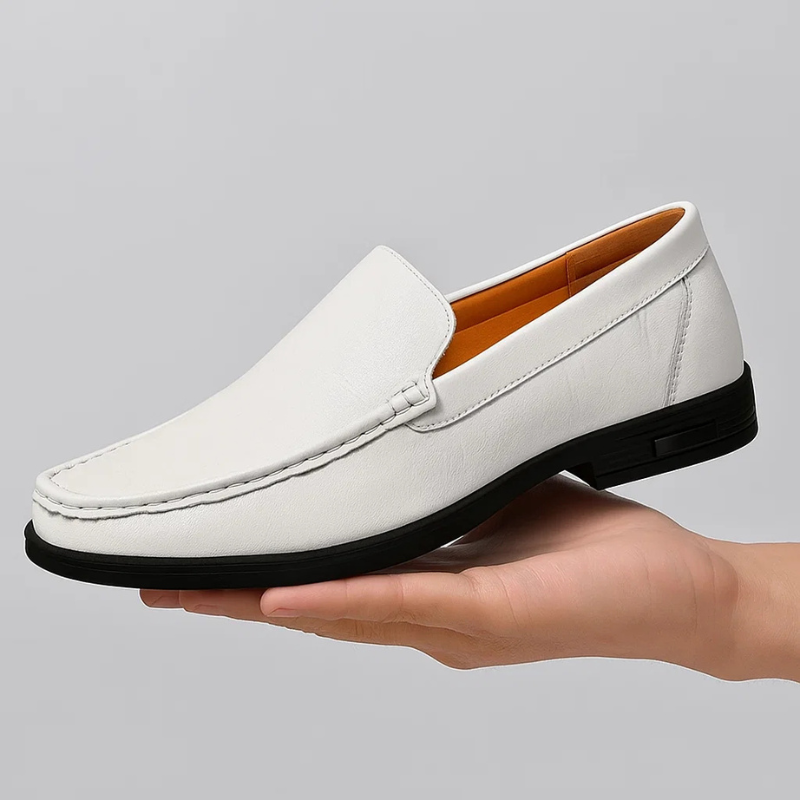 White leather slip-on loafers with moc stitching and black rubber sole