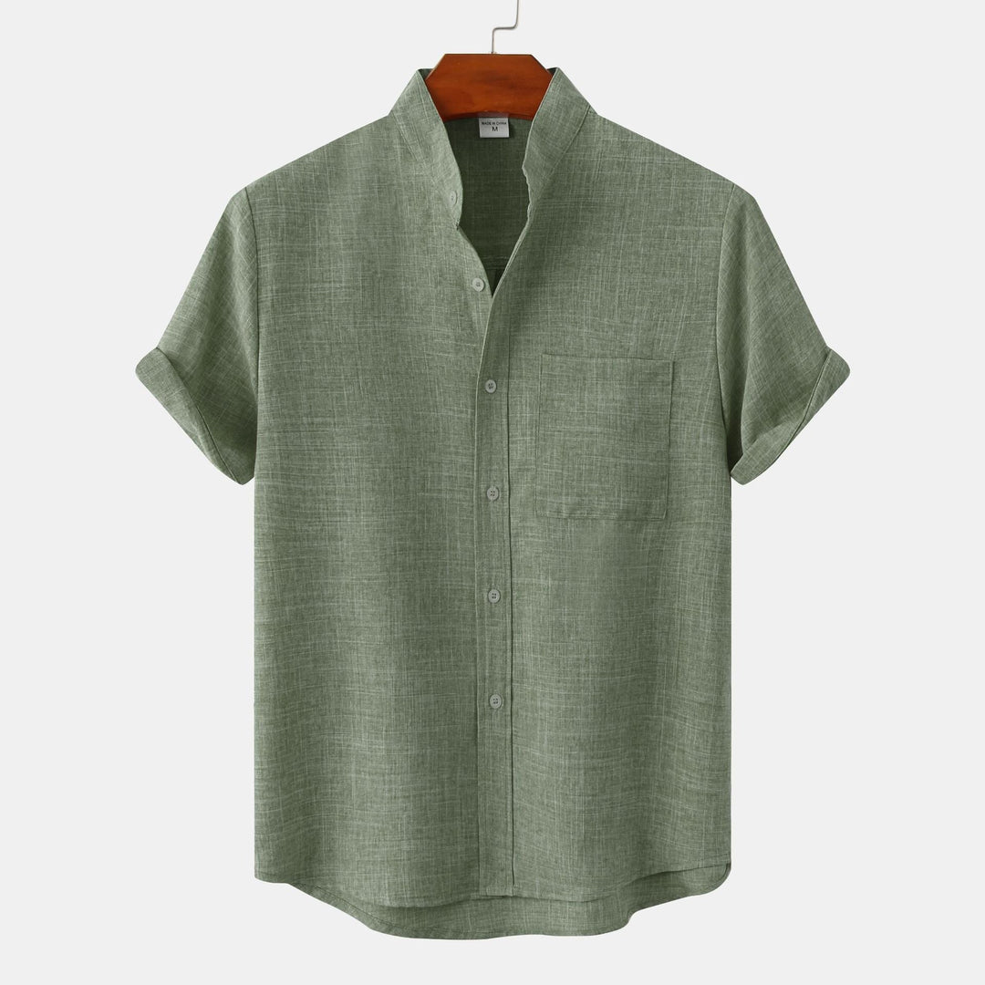 Green solid cotton button-up shirt with short sleeves and front buttons.